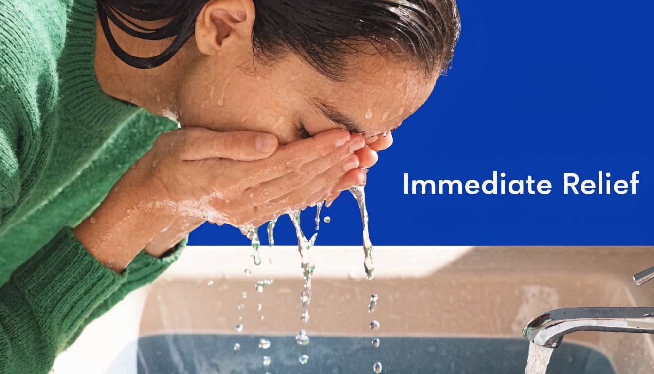 A person washing their face with water from a sink faucet for immediate relief from irritation.