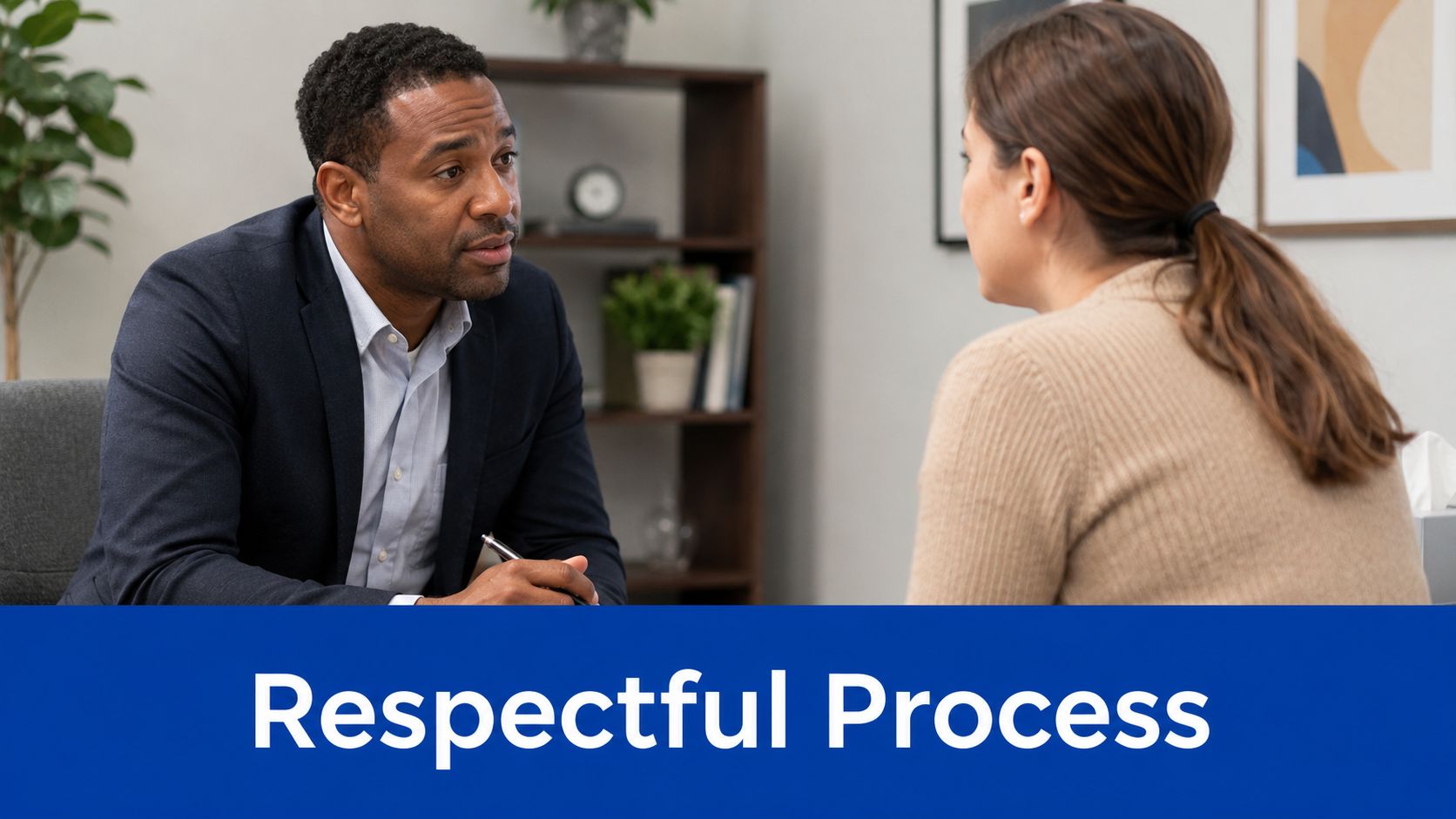 A professional man and woman having a serious and respectful conversation in an office setting.